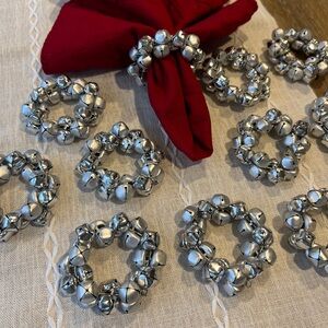 Silver tone jingle bell napkin rings. Set of 11. Great condition.
